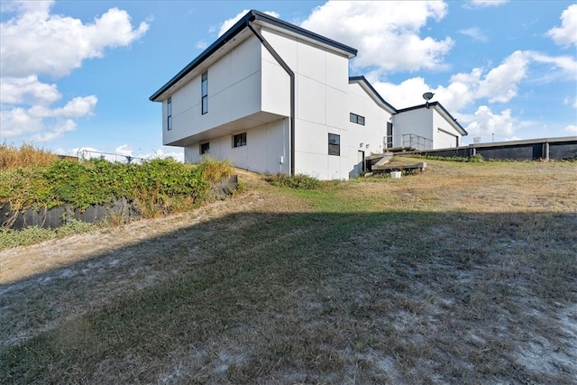 view of home's exterior with a lawn