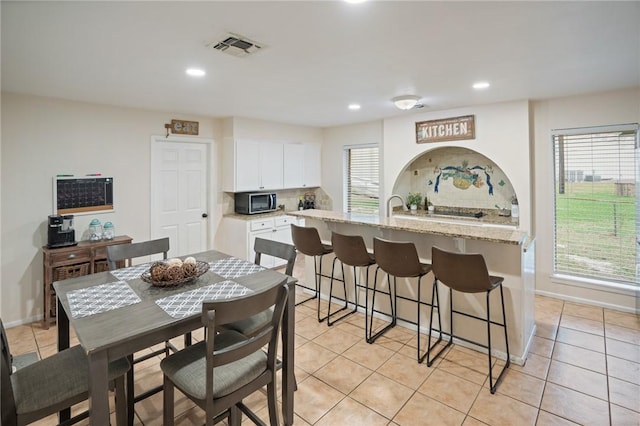 dining area featuring recessed lighting, visible vents, baseboards, and light tile patterned floors