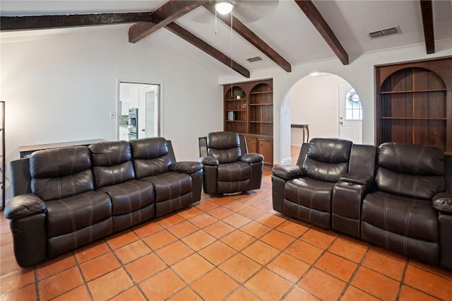 living room with arched walkways, vaulted ceiling with beams, visible vents, and built in features