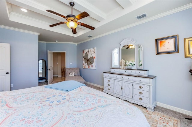 bedroom with crown molding, a tray ceiling, visible vents, and baseboards