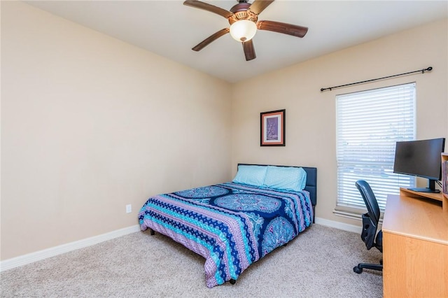 bedroom featuring carpet, baseboards, and a ceiling fan