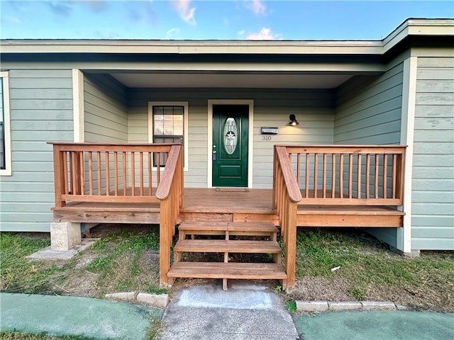 doorway to property with a porch