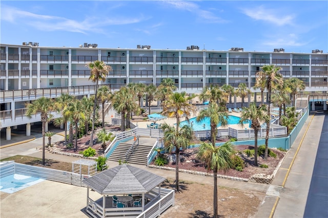 view of property featuring a community pool