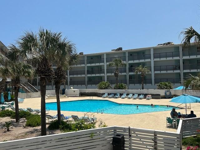 5973 State Highway 361 Unit 203, Port Aransas, TX 78373 - community pool featuring a patio