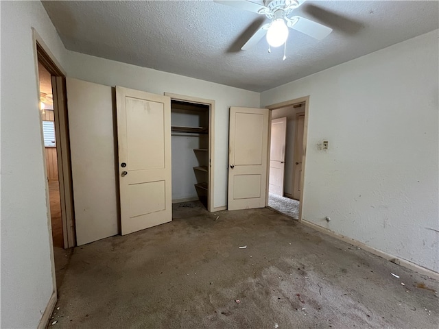 unfurnished bedroom with ceiling fan, a closet, carpet floors, and a textured ceiling