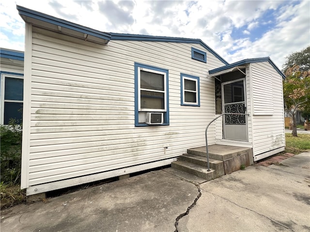 exterior space featuring a patio and cooling unit