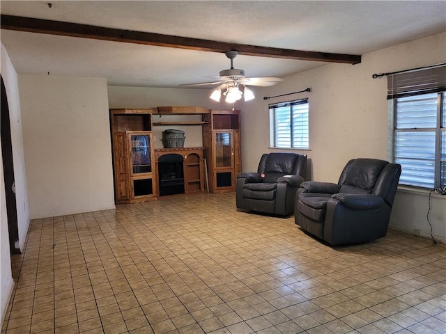 2021 Melisa Ln, Corpus Christi, TX 78412 - living area with beam ceiling, a ceiling fan, and a large fireplace