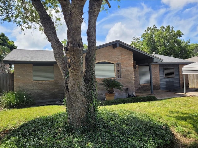 2021 Melisa Ln, Corpus Christi, TX 78412 - view of front of property with brick siding and a patio