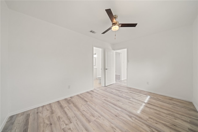 unfurnished room featuring light hardwood / wood-style floors and ceiling fan