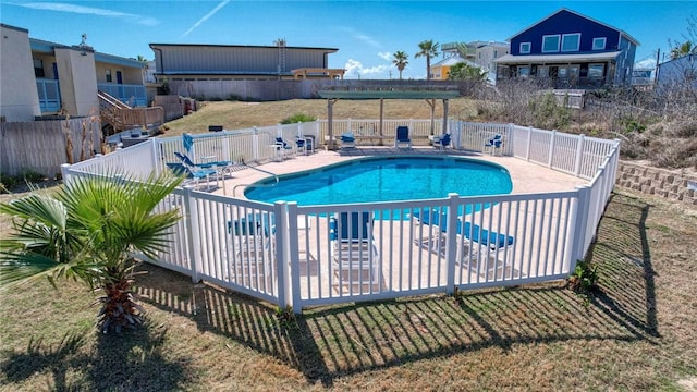 community pool with a patio area, fence, and a pergola