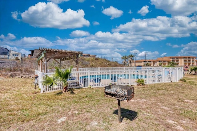 view of yard with fence, a community pool, and a pergola