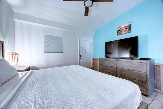 bedroom with ceiling fan and light tile patterned flooring