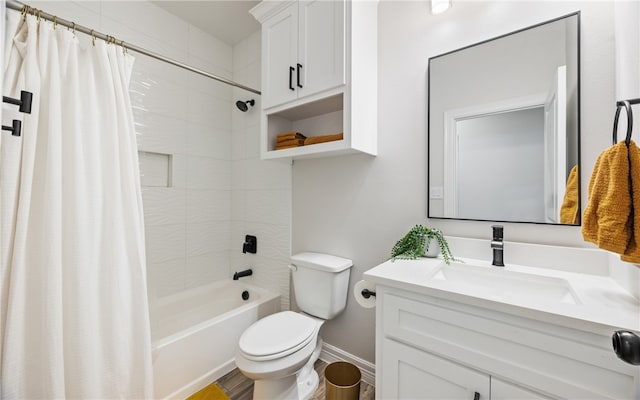 full bathroom with vanity, shower / tub combo, and toilet