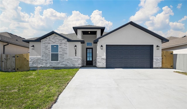 view of front facade with a garage and a front yard