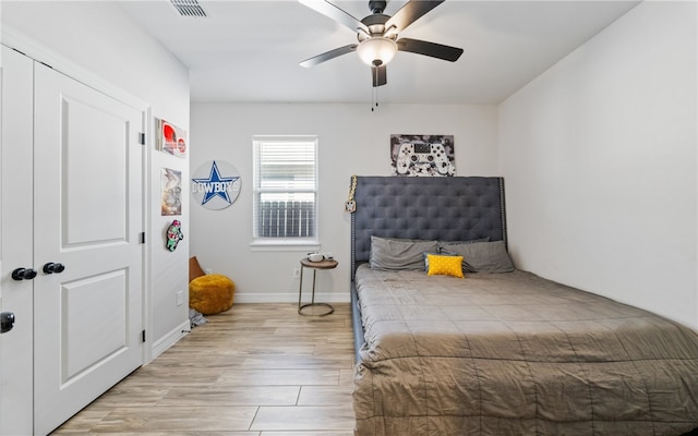 bedroom featuring ceiling fan and light hardwood / wood-style floors