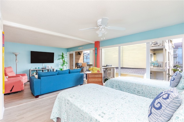 14810 Windward Dr Unit 203, Corpus Christi, TX 78418 - bedroom with wood finished floors and a ceiling fan