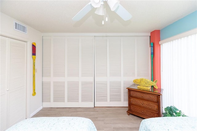 14810 Windward Dr Unit 203, Corpus Christi, TX 78418 - bedroom with wood finished floors and a ceiling fan