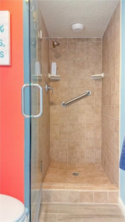 14810 Windward Dr Unit 203, Corpus Christi, TX 78418 - full bath featuring a stall shower and a textured ceiling