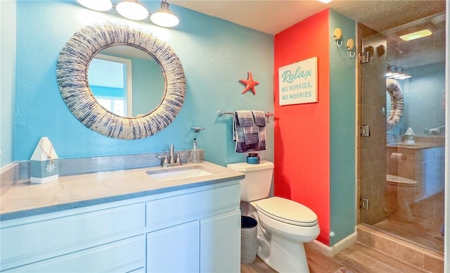 14810 Windward Dr Unit 203, Corpus Christi, TX 78418 - bathroom featuring vanity, wood finished floors, and a stall shower