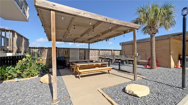14810 Windward Dr Unit 203, Corpus Christi, TX 78418 - fenced backyard with a patio