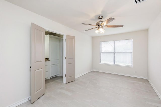 2325 Roseland Dr, Corpus Christi, TX 78414 - unfurnished bedroom featuring baseboards, visible vents, and a ceiling fan