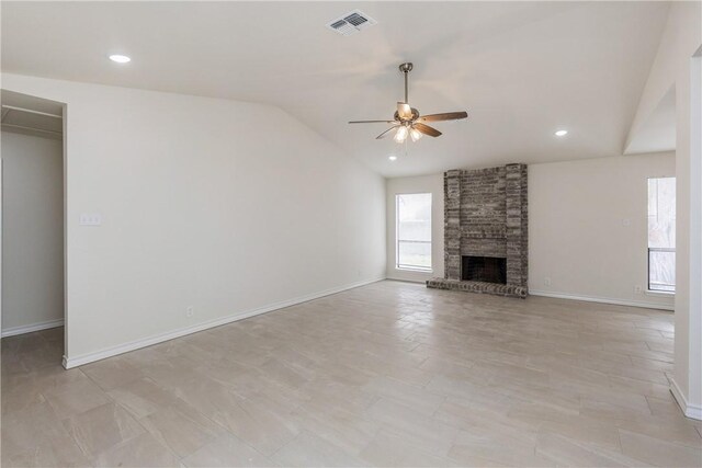 2325 Roseland Dr, Corpus Christi, TX 78414 - unfurnished living room featuring a brick fireplace, a ceiling fan, visible vents, baseboards, and lofted ceiling