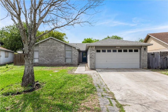 2325 Roseland Dr, Corpus Christi, TX 78414 - single story home with brick siding, fence, driveway, a front lawn, and an attached garage