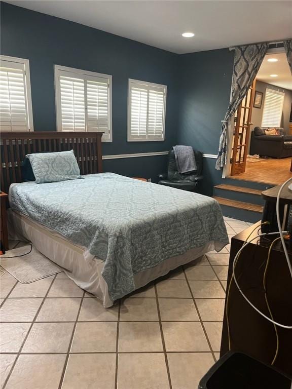 66 Redfish Dr, Rockport, TX 78382 - bedroom with light tile patterned floors and recessed lighting