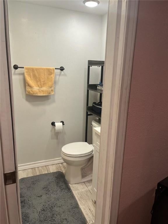 66 Redfish Dr, Rockport, TX 78382 - bathroom featuring toilet and wood finished floors