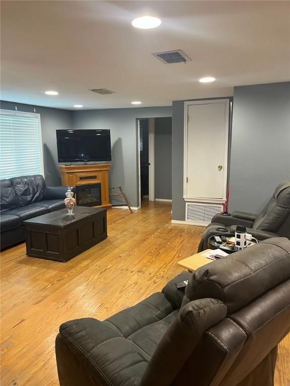 66 Redfish Dr, Rockport, TX 78382 - living room featuring light wood-style floors and recessed lighting