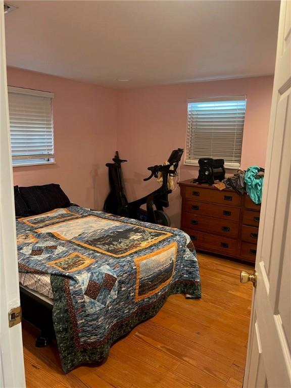 66 Redfish Dr, Rockport, TX 78382 - bedroom with light wood finished floors