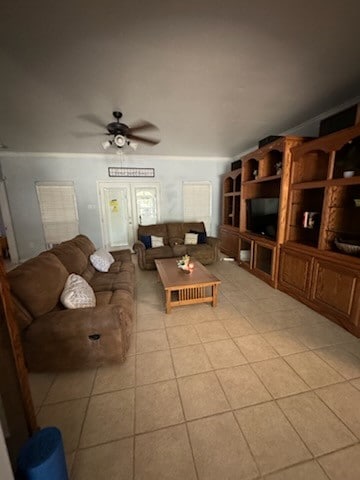 tiled living room featuring ceiling fan