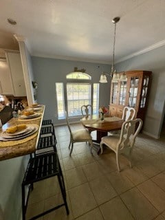 tiled dining room with crown molding