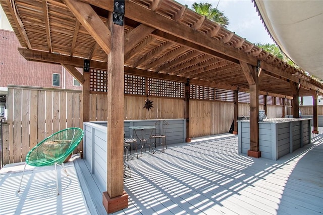 deck with fence, a patio, and a pergola