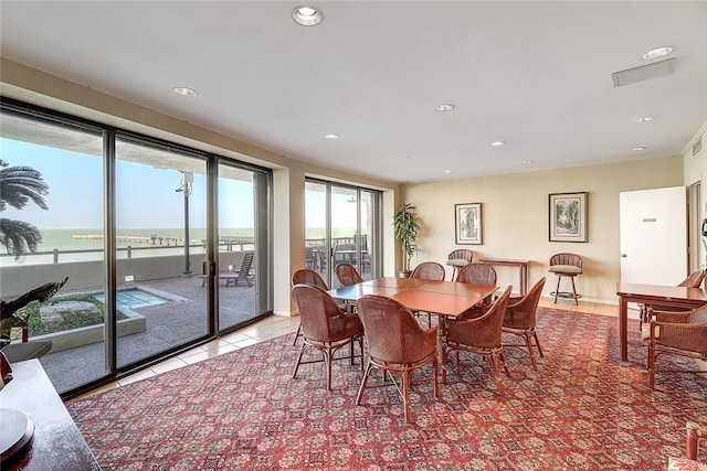 dining area with recessed lighting and light tile patterned flooring