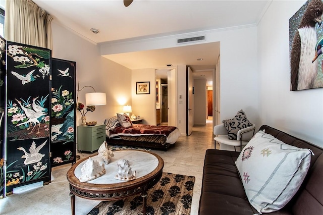 living room featuring visible vents and ornamental molding