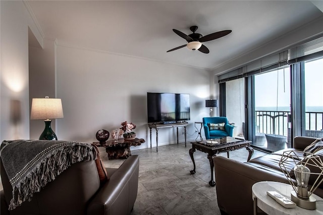 living room with ornamental molding and a ceiling fan