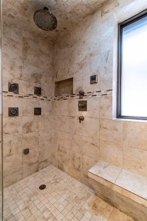 bathroom with a tile shower