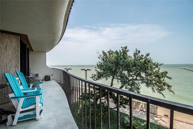 balcony featuring a water view