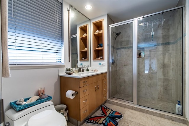 bathroom featuring recessed lighting, toilet, a shower stall, vanity, and tile patterned floors