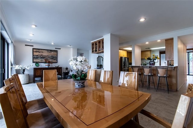 dining space featuring recessed lighting, visible vents, and wood finished floors