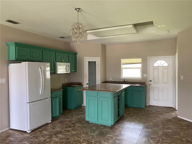 1622 S Reynolds St, Alice, TX 78332 - kitchen with white appliances, green cabinetry, a kitchen island, and dark countertops