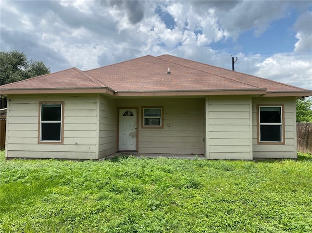 1622 S Reynolds St, Alice, TX 78332 - rear view of property featuring a shingled roof