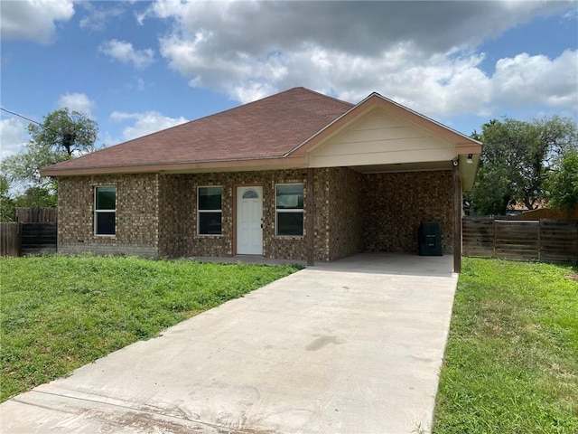 1622 S Reynolds St, Alice, TX 78332 - ranch-style home featuring concrete driveway, brick siding, a carport, and a shingled roof