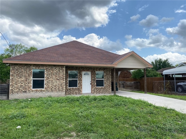 1622 S Reynolds St, Alice, TX 78332 - view of front facade featuring driveway, a carport, brick siding, and roof with shingles