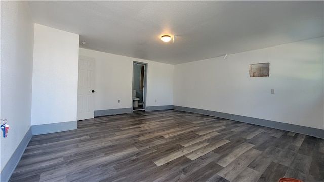 empty room featuring dark hardwood / wood-style floors