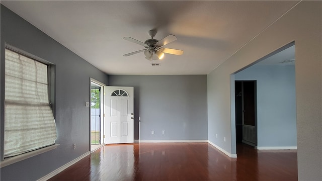 foyer featuring dark hardwood / wood-style flooring and ceiling fan