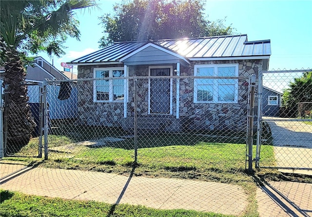 bungalow-style house with a front lawn