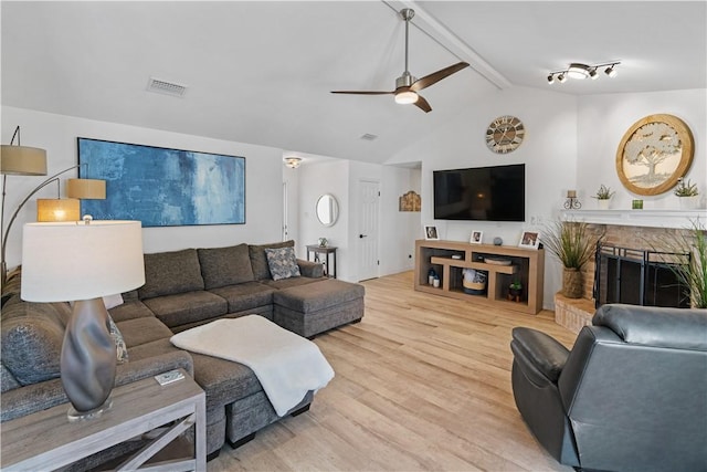 15209 Dasmarinas Dr, Corpus Christi, TX 78418 - living room featuring wood finished floors, ceiling fan, and a fireplace
