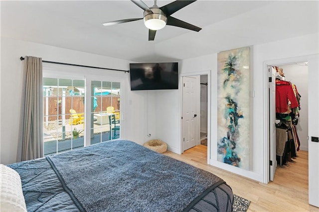 15209 Dasmarinas Dr, Corpus Christi, TX 78418 - bedroom featuring a spacious closet, light wood-style floors, access to exterior, and ceiling fan